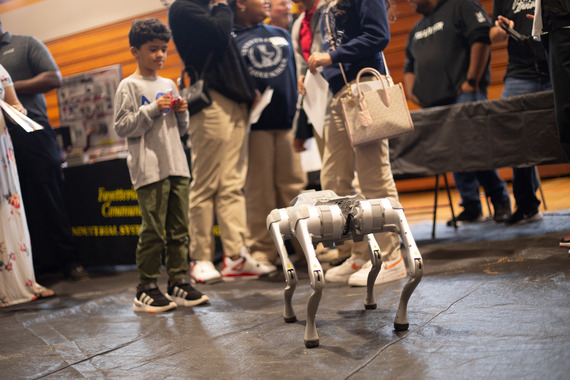 Student Operating Electronic Robot