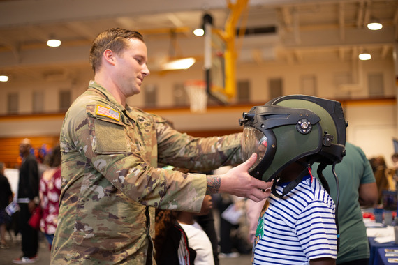 Student tries on electronic helmet.