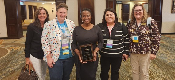 Benjamin Martin Elementary School Principal Corrine Warren (third from left) celebrates with conference attendees and CCS staff. 