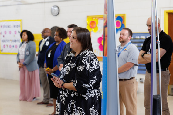 Educators listen intently to the Governor.