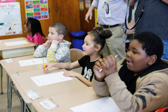 Second Graders listen intently to the Governor