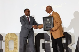 Dr. Connelly receiving the Key to the City from Mayor Colvin