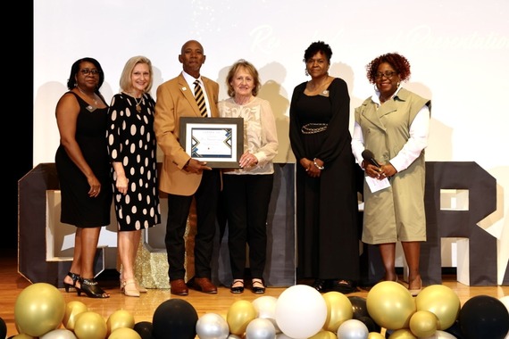 Dr. Connelly poses with Board Members