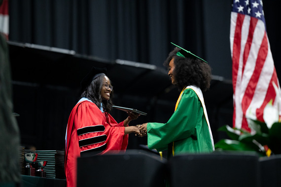 Dr. McDonald Awarding PFHS Senior her Diploma
