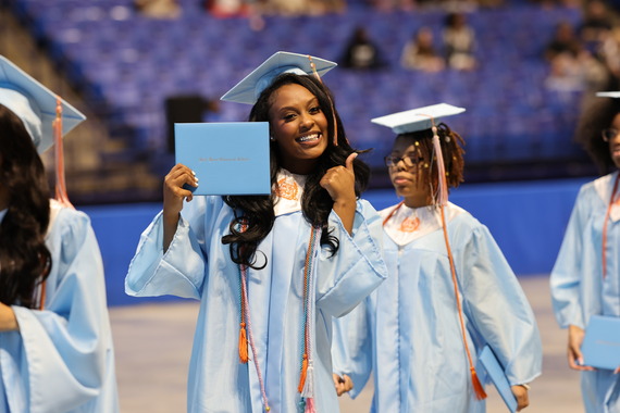 RRCHS Graduate Flashes Her Diploma & A Smile