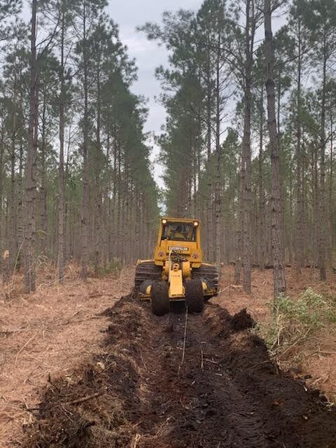 Chris "Biggin" Holyfield installing fire lines in preparation for a prescribed burn.