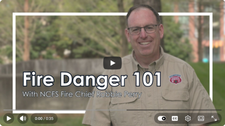 N.C. Forest Service Fire Chief Robbie Perry standing in front of an urban forest