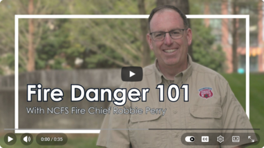 N.C. Forest Service Fire Chief Robbie Perry standing in front of an urban forest