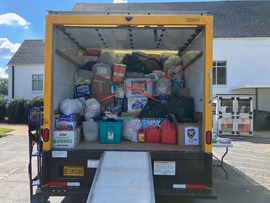 Fall on First Avenue Hurricane Relief Truck Shown Full of Donations