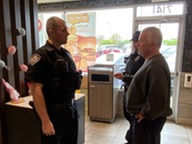 Knightdale's Coffee with a cop - Police officers speak with a local resident