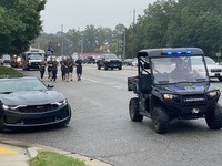 Torch Run Participants Preparing to pass the Torch to Wake County Public Safety team