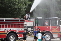Camp PRIDE kids enjoying water games from Knightdale Fire Truck