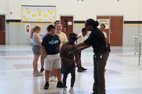 Camp PRIDE Students try on goggles that show effects of drinking and driving