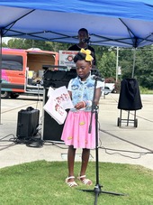 Young student reads a book at the Arts and Education Festival 