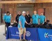 Rotary Club and Town Councilors gave out bookbags at the Arts and Education Festival