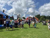 The community enjoyed inflatables for kids at the Arts and Education Festival
