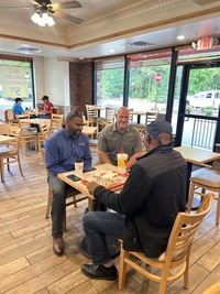 Knightdale Police Department and Mayor Pro Tem Steven Evans talk to residents at Coffee with a Cop event