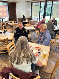 Chief Capps speaks to residents at Coffee with a Cop event at Bojangles in Knightdale, NC