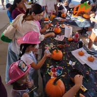 Kids decorate pumpkins at the Fall on First Avenue event in Knightdale, NC