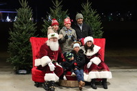 Santa with a family at the Knightdale Christmas Tree Lighting Event
