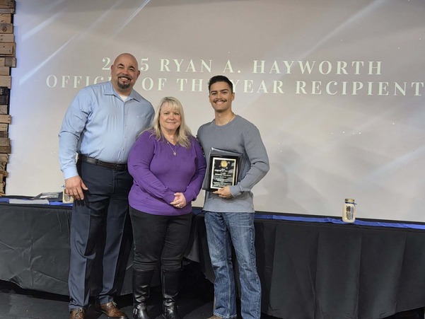 Chief Capps poses with Officer of the Year, Officer Valerio