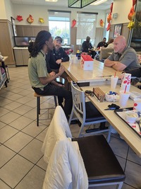Knightdale Police Talk to residents at Coffee with a cop event