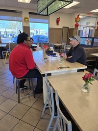 Knightdale Police Talk to residents at Coffee with a cop event