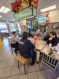 Knightdale Police Talk to residents at Coffee with a cop event