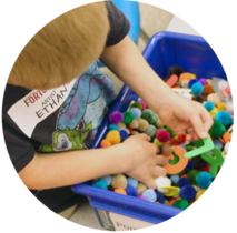 Kid playing with sensory friendly objects at Sertoma's Sensory Saturday