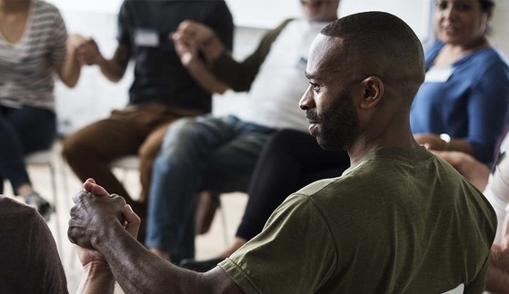 Diverse group holding hands equity