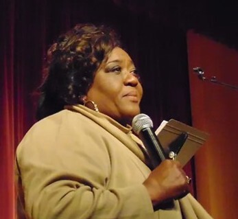 Mary D Williams with microphone