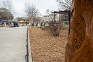 A sign reads “Moore Square 1792” with the park in the background.