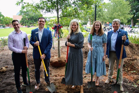 People with shovels getting ready to do a tree planting
