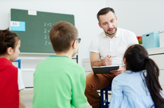 School psychologist talking to children