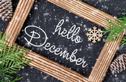 Hello December - written in script on a chalkboard in the snow