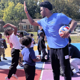 adult with youth being active outside