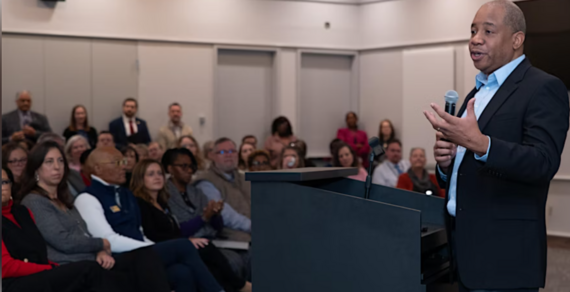 Superintendent Mo Green at Podium speaking to audience