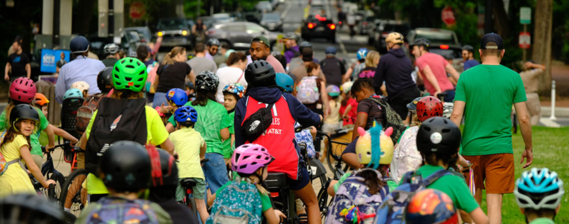 young people and adults on bikes for bike to school event