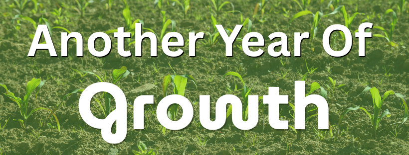 A Year of Growth Banner with baby corn plants in the backgrown