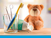 Teddy bear and children's dental equipment