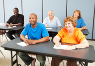 People sitting in a classroom setting