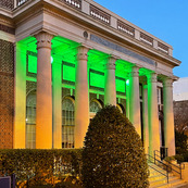 Historical Post Office with Green Lighting at Dusk