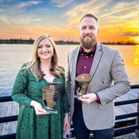 Liz and Ethan Accepting Awards outdoors at Sunset