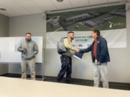 Management Team Presents Jonathan Daniel Caught in the Act Award