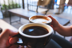 Coffee cup in coffee shop setting