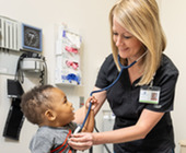 Public Health Nurse and young patient 