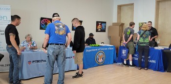 Vendors and veterans in discussion during the event