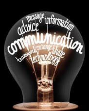 Light bulb containing the following words: communication, teamwork, advice, message, information, exchange, share, technology