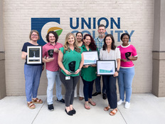 Eight employees in Public Communications department holding several awards