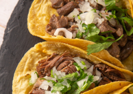 Carnita tacos with onion and cilantro